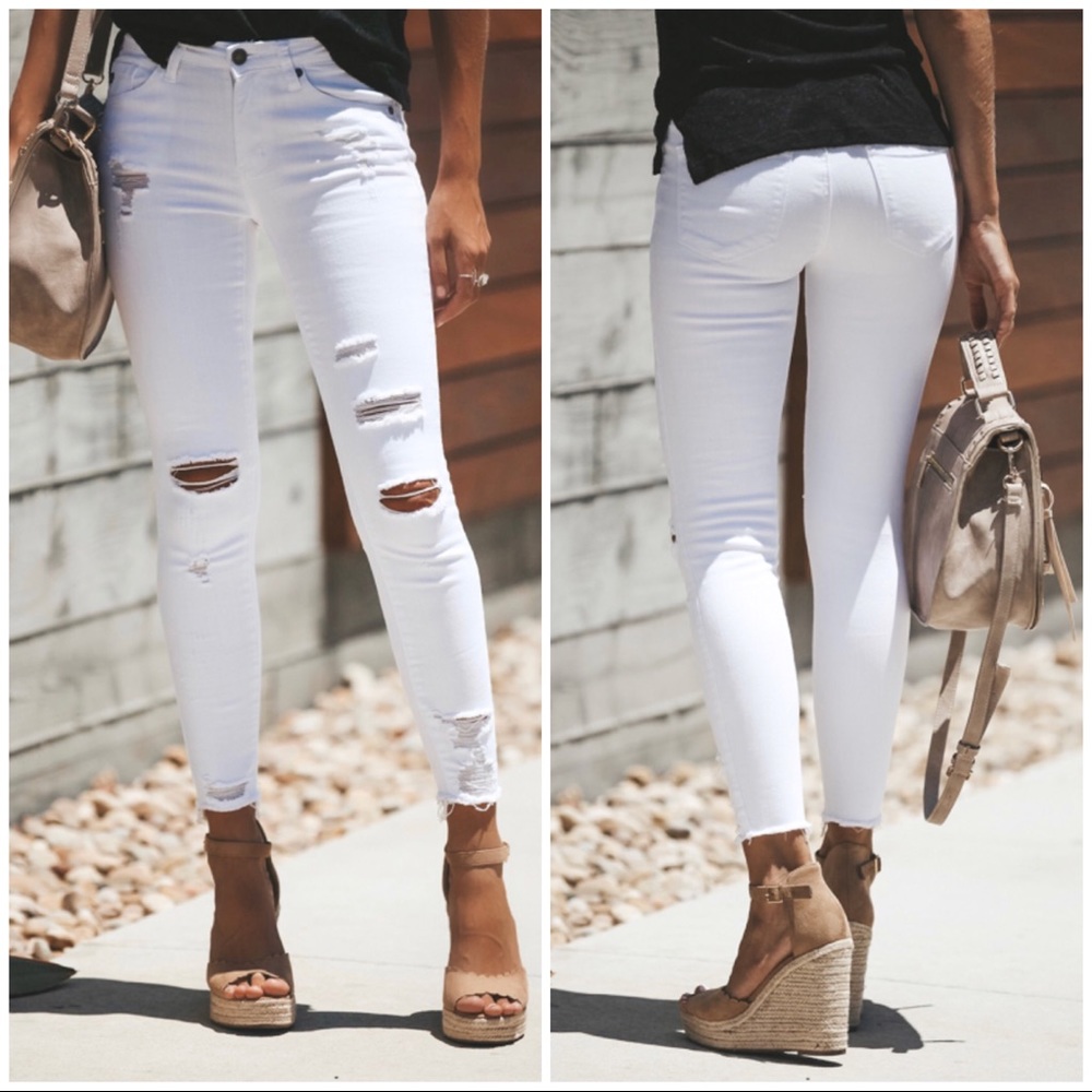 Distressed frayed white skinny jeans!.